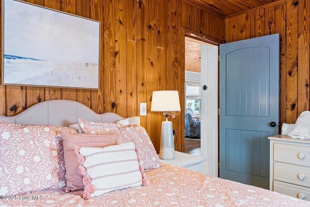 bedroom with wood walls