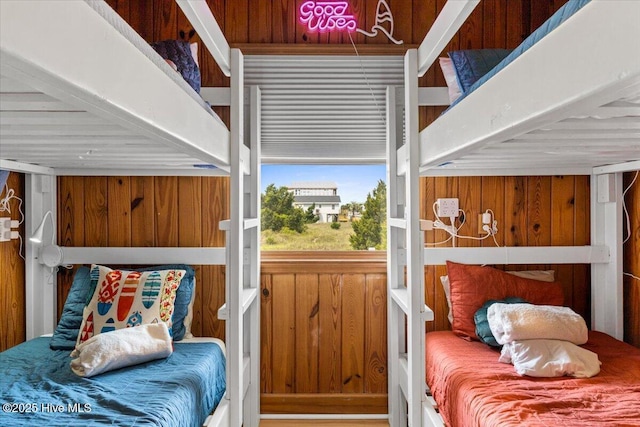 bedroom with wood walls