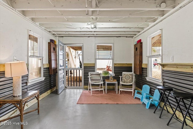 miscellaneous room featuring a wealth of natural light and finished concrete flooring