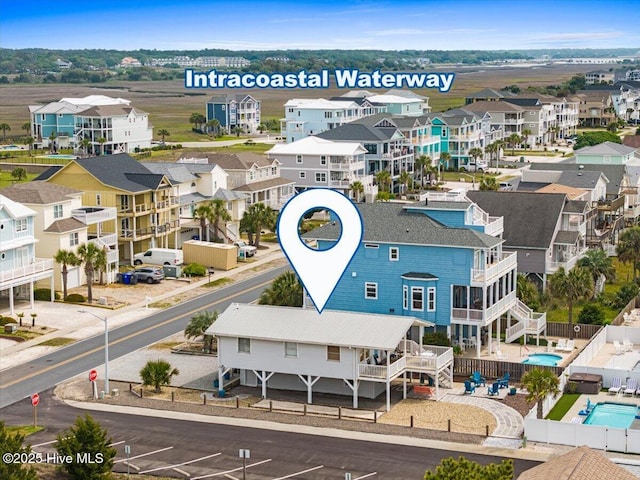 birds eye view of property with a residential view
