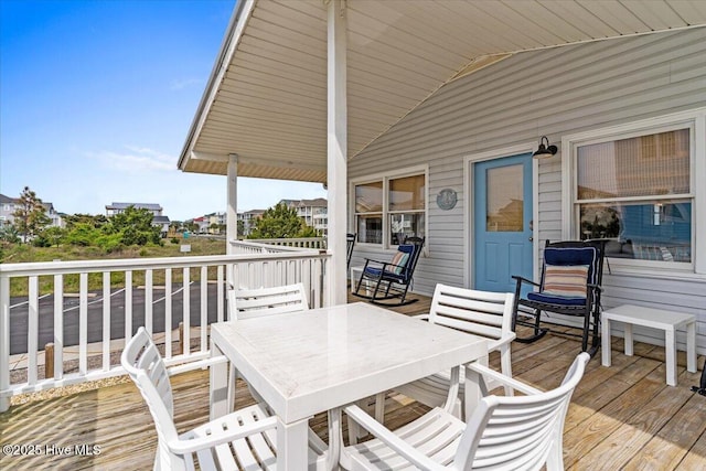 deck featuring outdoor dining area