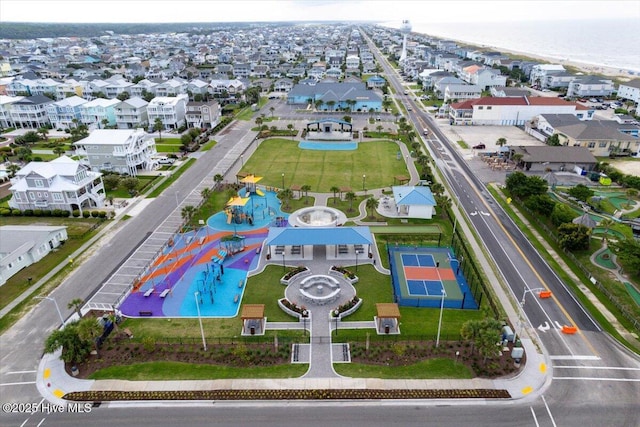 drone / aerial view with a residential view and a water view