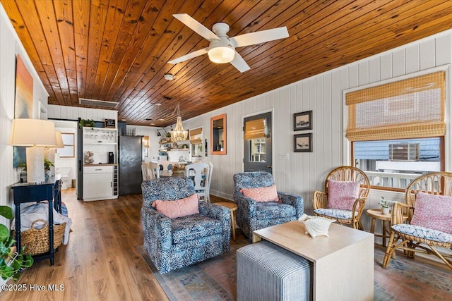living room featuring a barn door, wooden ceiling, wood finished floors, and ceiling fan with notable chandelier