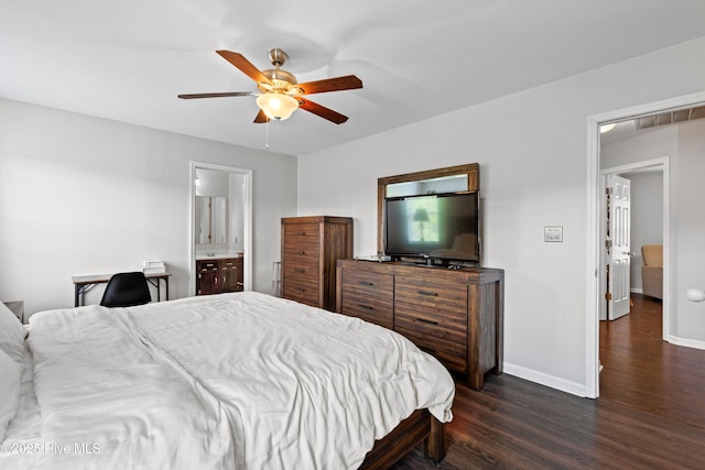 bedroom featuring baseboards, ceiling fan, ensuite bathroom, dark wood-style floors, and visible vents