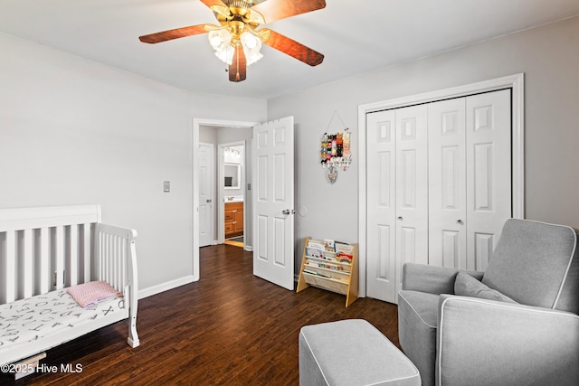 bedroom featuring ceiling fan, baseboards, dark wood finished floors, and a closet