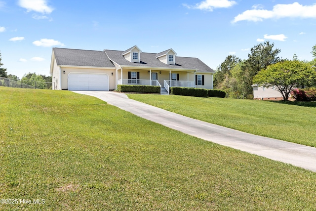new england style home with driveway, covered porch, a front yard, an attached garage, and fence