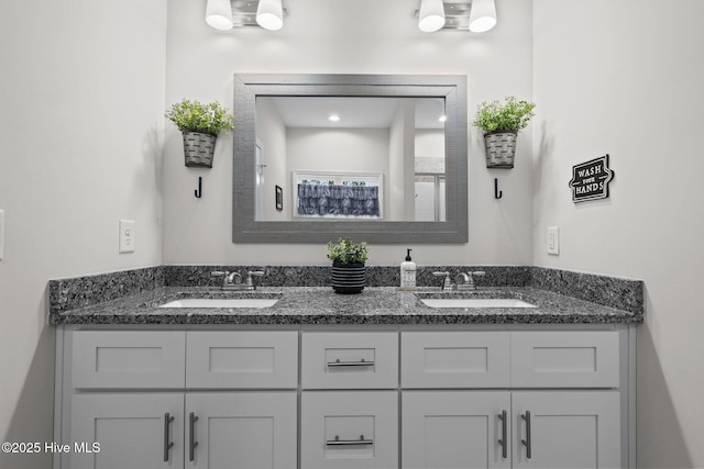 bathroom with double vanity and a sink