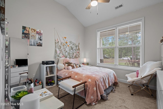 carpeted bedroom with ceiling fan, visible vents, baseboards, and vaulted ceiling