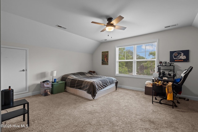 carpeted bedroom featuring baseboards, visible vents, ceiling fan, and lofted ceiling