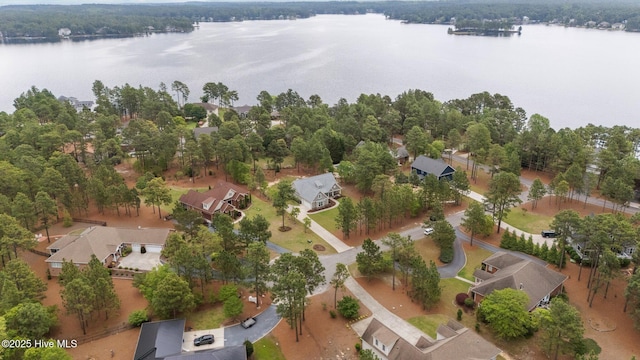 drone / aerial view featuring a water view and a residential view