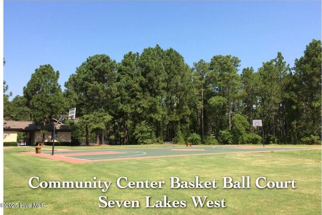 view of sport court with a yard and community basketball court