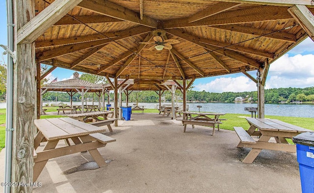 view of home's community featuring a water view, a gazebo, and a lawn