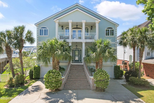 107 Waterway Crossing Ct, Little River, SC 29566 - view of front of house with driveway, a balcony, a garage, and stairs