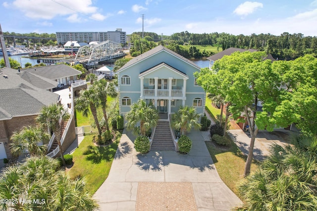 107 Waterway Crossing Ct, Little River, SC 29566 - coastal inspired home featuring a balcony, stairs, and driveway