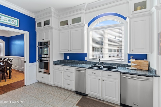 107 Waterway Crossing Ct, Little River, SC 29566 - kitchen with stainless steel appliances, a sink, white cabinets, crown molding, and a wainscoted wall