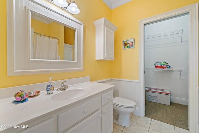 107 Waterway Crossing Ct, Little River, SC 29566 - bathroom with tile patterned floors, wainscoting, vanity, toilet, and ornamental molding