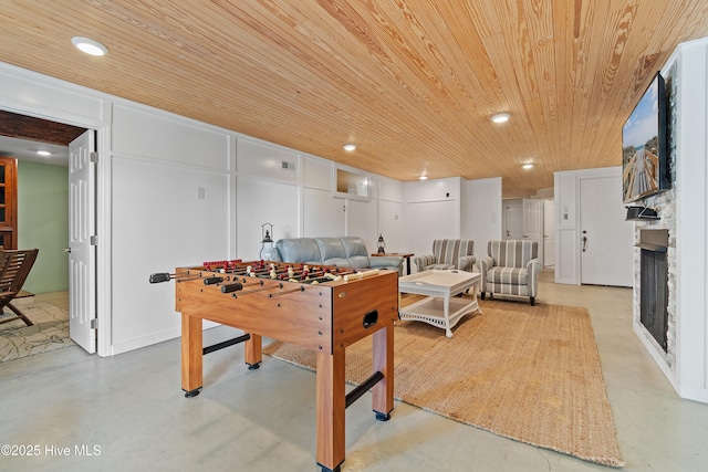 107 Waterway Crossing Ct, Little River, SC 29566 - recreation room with wooden ceiling, finished concrete flooring, a stone fireplace, and recessed lighting
