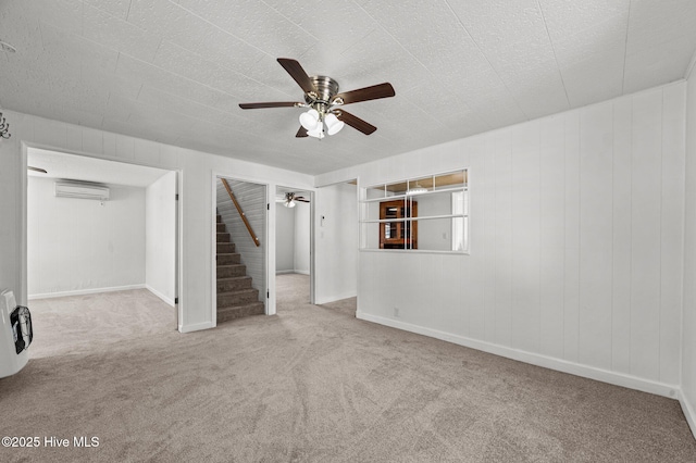 480 Croatan St, Belhaven, NC 27810 - basement featuring ceiling fan, carpet floors, stairs, heating unit, and a wall mounted AC