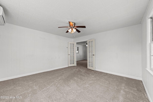 480 Croatan St, Belhaven, NC 27810 - unfurnished bedroom featuring carpet floors, a ceiling fan, french doors, and a wall mounted air conditioner