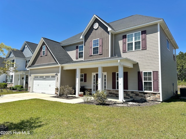 view of front facade featuring driveway, board and batten siding, stone siding, covered porch, and a front yard