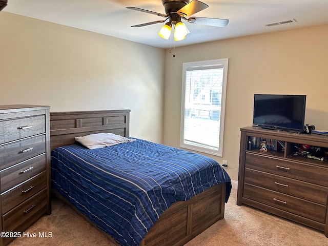 bedroom featuring visible vents, ceiling fan, baseboards, and carpet floors