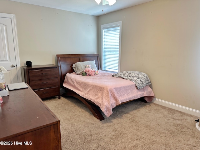 bedroom with carpet floors and baseboards