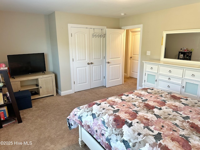 carpeted bedroom featuring a closet