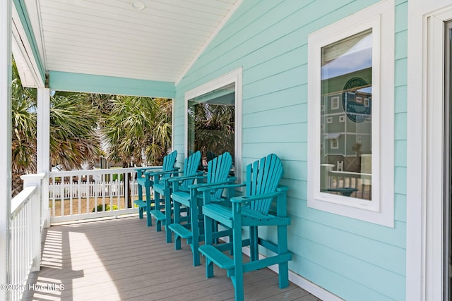 wooden terrace featuring covered porch