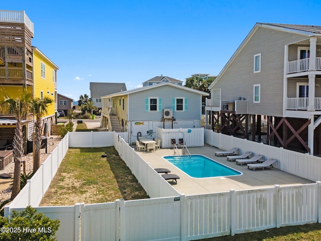 view of swimming pool with a fenced in pool, a patio area, and a fenced backyard