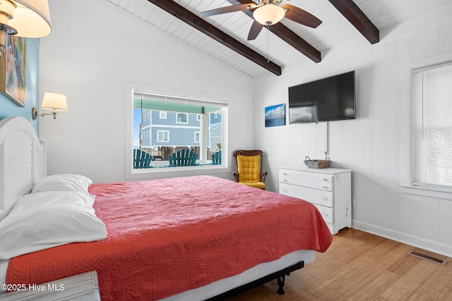 bedroom with vaulted ceiling with beams, a ceiling fan, visible vents, wood ceiling, and wood finished floors
