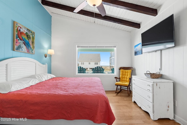 bedroom with vaulted ceiling with beams, ceiling fan, light wood-style flooring, and wood ceiling