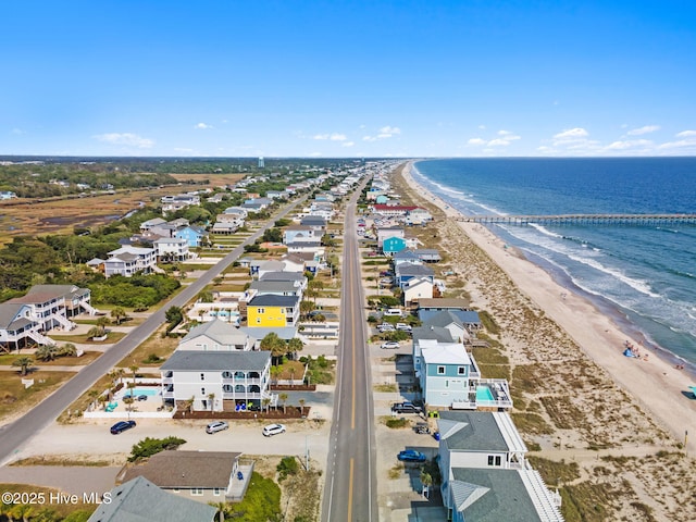aerial view featuring a view of the beach and a water view