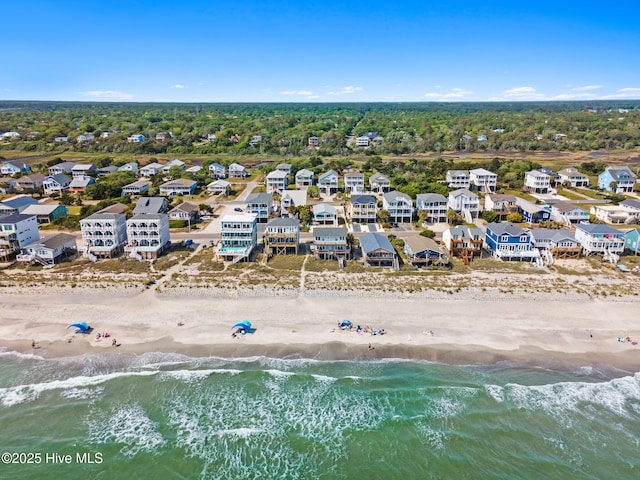 aerial view with a residential view, a view of the beach, and a water view