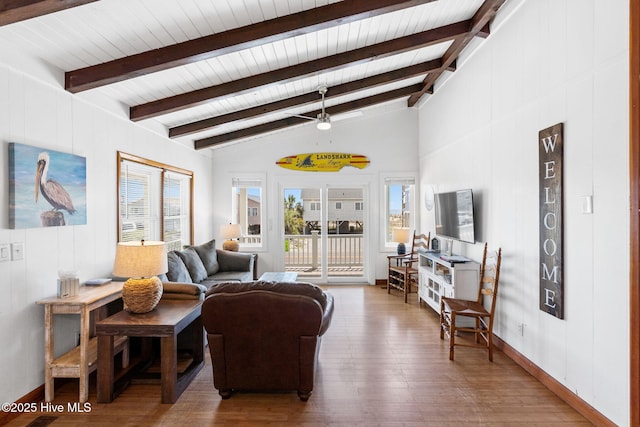 living room featuring wooden ceiling, vaulted ceiling with beams, a ceiling fan, and wood finished floors