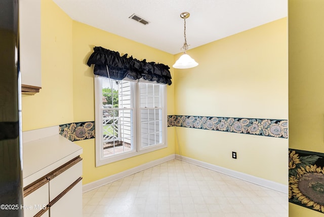 3012 Remington Dr, Wilmington, NC 28405 - unfurnished dining area with visible vents, baseboards, and light floors