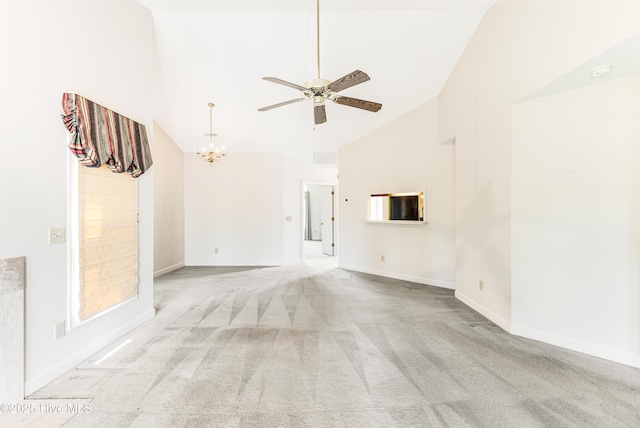 3012 Remington Dr, Wilmington, NC 28405 - unfurnished living room with carpet flooring, high vaulted ceiling, baseboards, and ceiling fan with notable chandelier