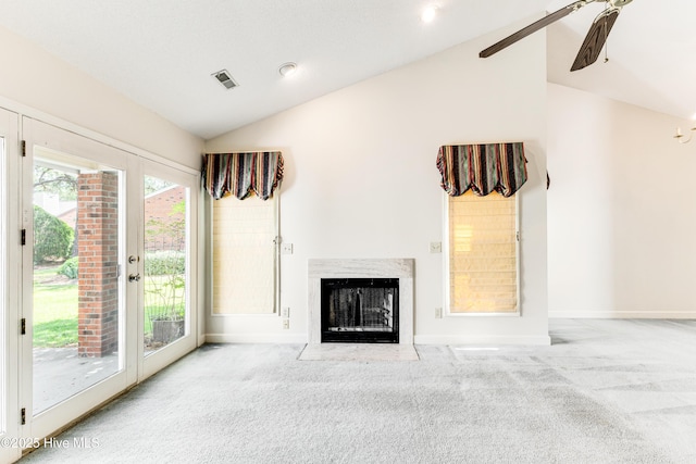 3012 Remington Dr, Wilmington, NC 28405 - unfurnished living room with visible vents, carpet floors, baseboards, lofted ceiling, and a premium fireplace