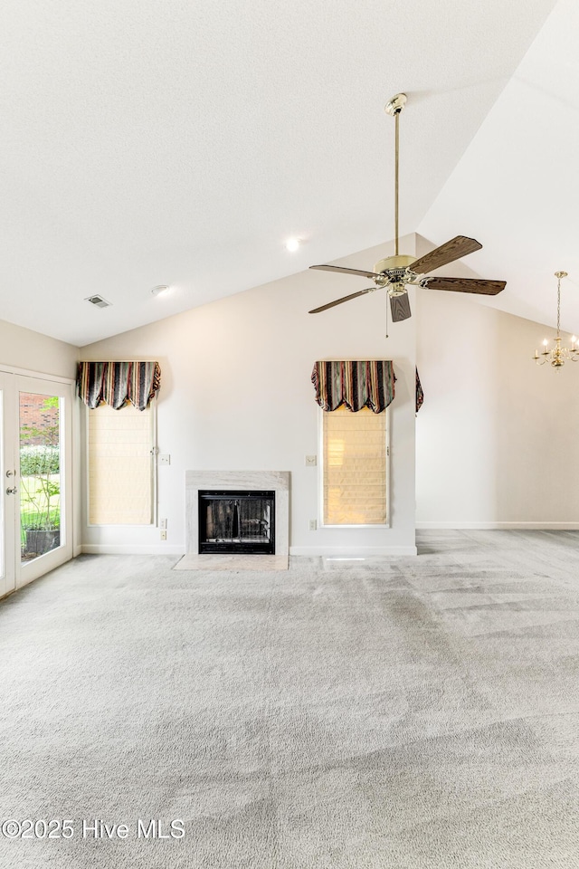 3012 Remington Dr, Wilmington, NC 28405 - unfurnished living room featuring visible vents, a fireplace with flush hearth, baseboards, lofted ceiling, and carpet