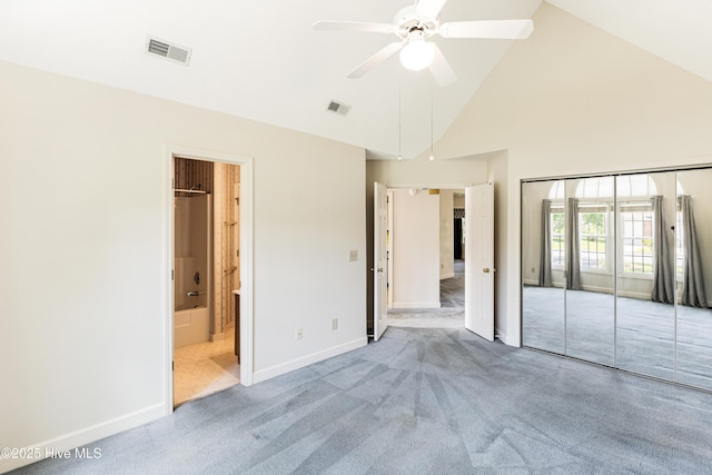 3012 Remington Dr, Wilmington, NC 28405 - unfurnished bedroom with a closet, visible vents, baseboards, high vaulted ceiling, and carpet flooring