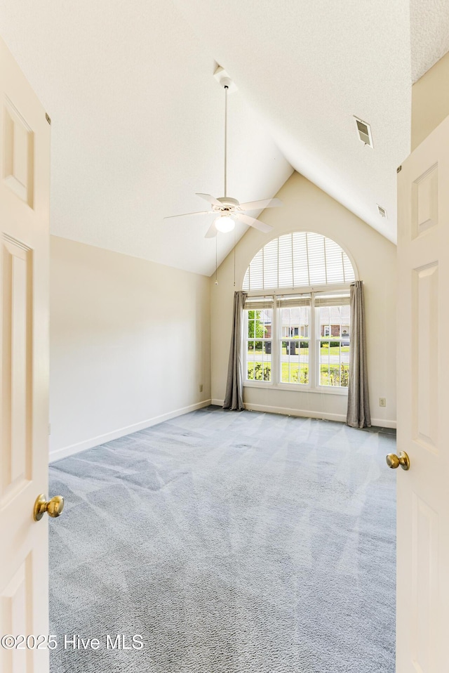 3012 Remington Dr, Wilmington, NC 28405 - unfurnished room featuring ceiling fan, carpet floors, high vaulted ceiling, baseboards, and visible vents