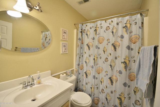 bathroom with visible vents, a shower with curtain, toilet, and vanity
