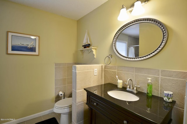 bathroom featuring vanity, toilet, tile patterned floors, tile walls, and curtained shower