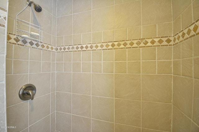 full bath featuring a tile shower