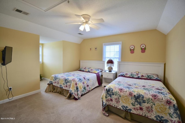 bedroom with vaulted ceiling, visible vents, ceiling fan, and carpet