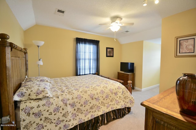 bedroom featuring visible vents, vaulted ceiling, and light carpet