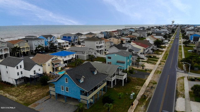 bird's eye view with a water view and a residential view
