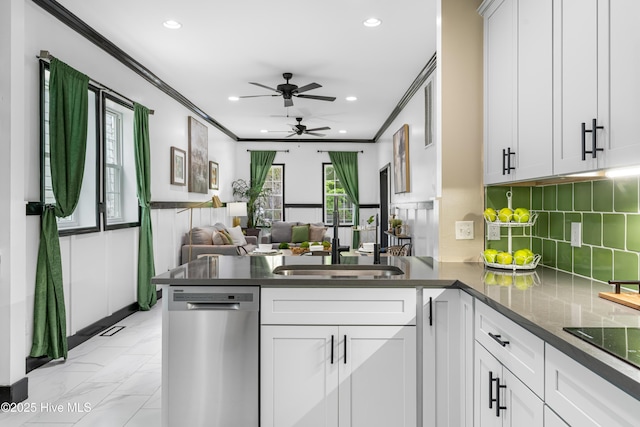 kitchen with stainless steel dishwasher, dark countertops, recessed lighting, a peninsula, and a ceiling fan