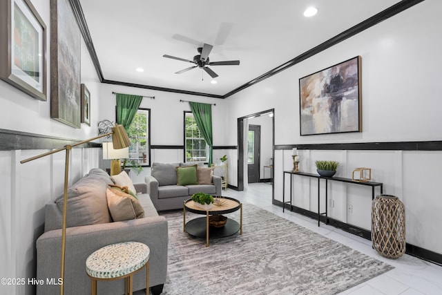 living room featuring ornamental molding, recessed lighting, ceiling fan, and wainscoting