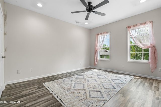 unfurnished room featuring wood finished floors, ceiling fan, recessed lighting, and baseboards