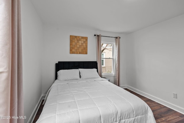1107 Adams St N, Wilson, NC 27893 - bedroom featuring dark wood finished floors and baseboards